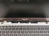 a close up of a laptop computer with a broken keyboard