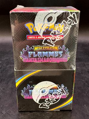 une boîte de cartes à collectionner Pokémon posée sur une surface noire