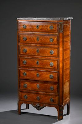 an antique chest of drawers with a marble top
