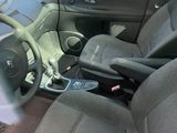 the interior of a car with a steering wheel and a dashboard