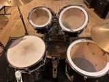 a drum set that is sitting on a table in a room