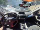 dashboard of a car with a view of a street from inside of it