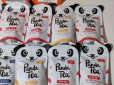 several packages of panda tea sitting on top of a table