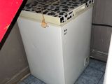 a white refrigerator with a black and white pattern on it
