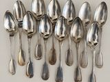 a lot of spoons that are sitting on a table