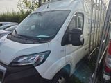 a white van that is parked in a parking lot