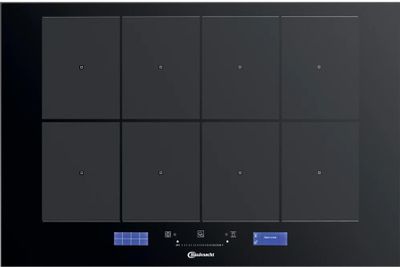 une plaque de cuisson noire à quatre feux et quatre boutons
