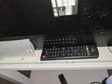 a remote control sitting on top of a tv