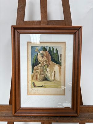 une image représentant un tableau où l'on voit un chien allongé sur un chevalet en bois