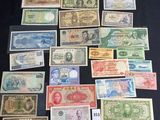 several different types of paper money laid out on a table