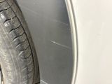 a close up of a tire on the side of a car