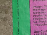 a pink and green ticket for a movie theater
