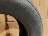 tire tread of a car on a cardboard box in a room