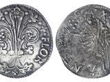 a silver coin with an image of a man on it
