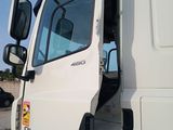 a large white truck parked on the side of the road