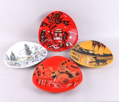 trois assiettes à motifs différents posées sur une surface blanche