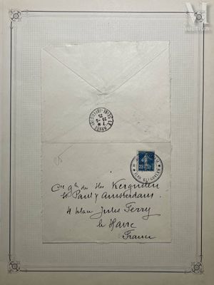an old envelope with a stamp on it is hanging on a wall
