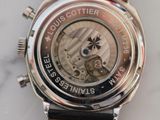 a close up of a watch on a marble surface