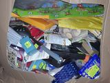 a cardboard box filled with assorted items on the floor