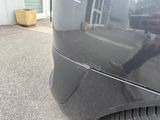 a black car with a sticker on the side of it