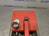 an image of a red machine with a gauge on it