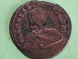 an old coin with a picture of a man on it