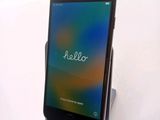 a cell phone that is sitting on top of a stand