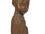statue of a young boy in a brown shirt on a white background