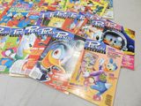 a lot of comic books that are on the table
