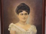 painting of a woman in a white dress in a brown frame