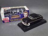 james dean ' s model of a black car with a box