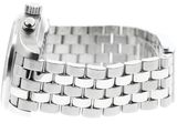 a silver watch that is sitting on a white surface