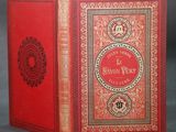 a red book with gold trimming and a red cover
