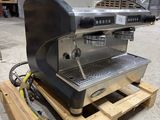 an espressor machine sitting on a pallet in a warehouse