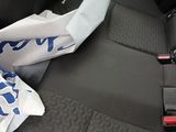 a car seat with a blue and white scarf on it