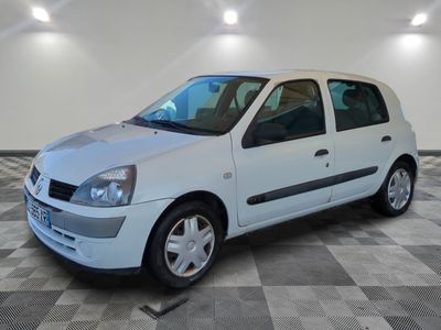 a picture of a white car parked in a garage