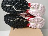 a close up of a pair of shoes on top of a cardboard box