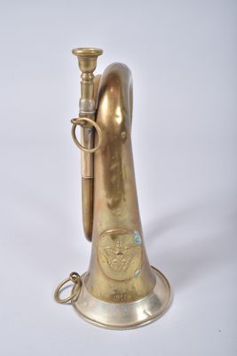 an old brass trumpet with a brass bell on a white background