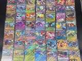 the pokemon cards are stacked on top of each other on a table