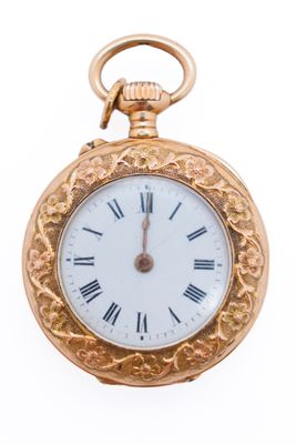 a gold pocket watch with roman numerals on it