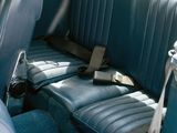 a seat in the back of a car with a bag on it