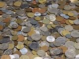 a lot of coins that are on the table