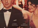 une affiche de cinéma représentant un homme et une femme en smoking