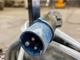 a close up of a hose connected to a pole