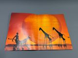 an open book with a picture of giraffes and a man on a horse