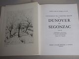 an open book with a drawing of a snowy landscape