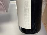 a bottle of wine that is sitting on a tray