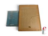 a picture of a wooden box with a piece of paper on it