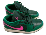 a pair of green and pink shoes on a white surface