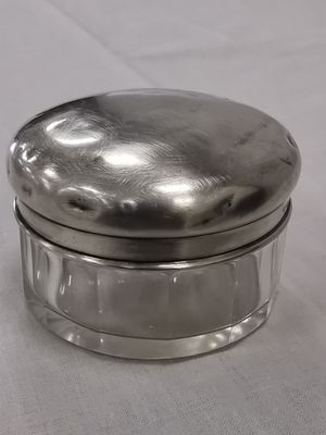 an image of a silver box sitting on top of a white table